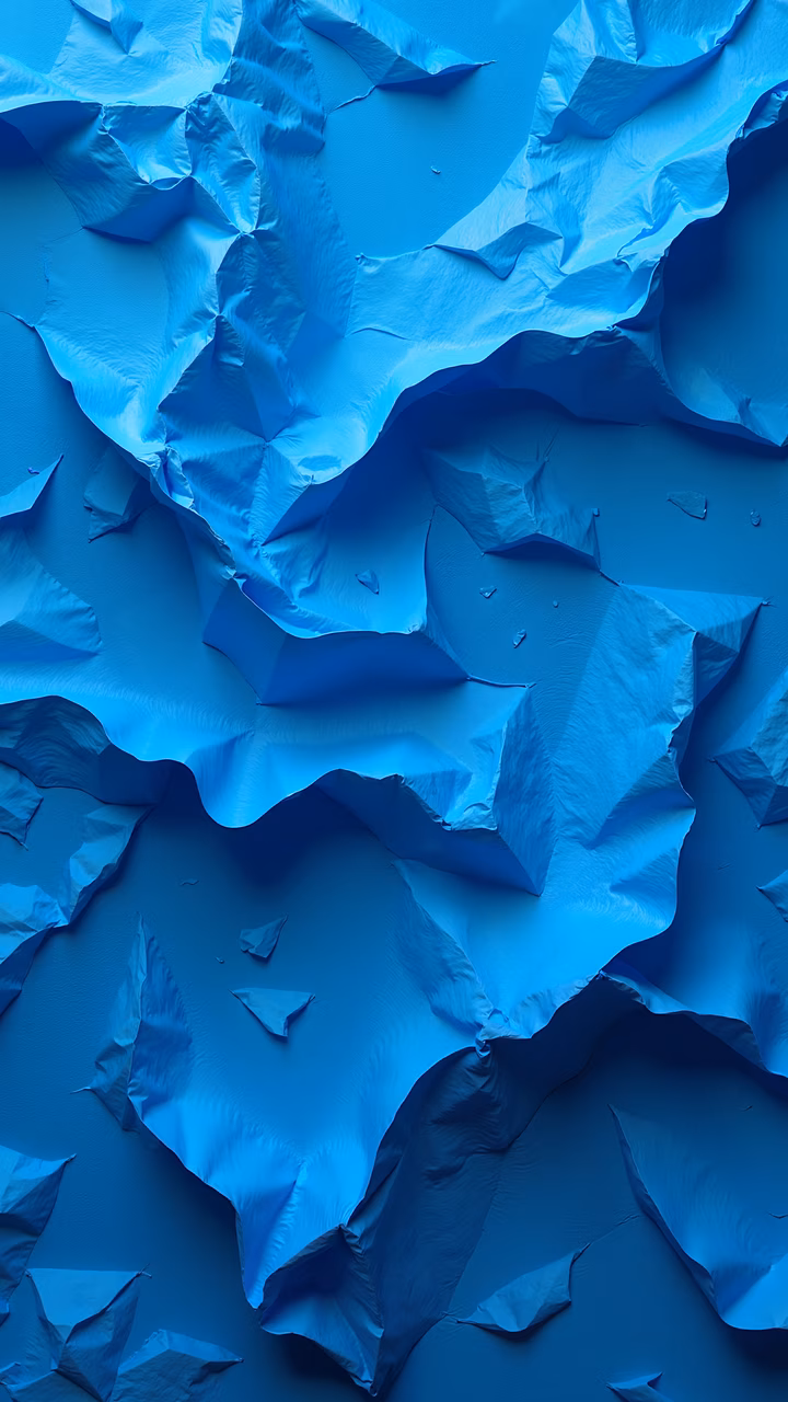 Abstract illustration of crumpled blue paper with intricate folds and textures in cool blue tones.