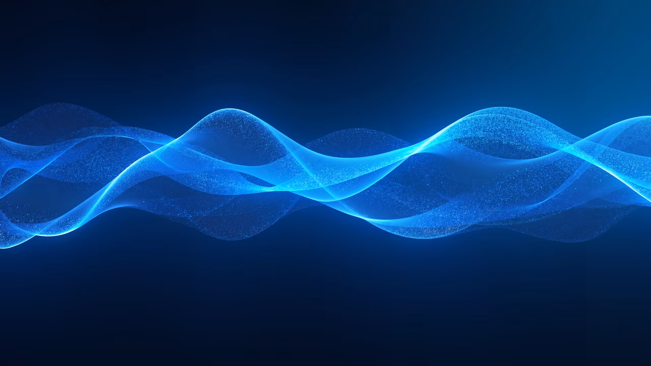 Abstract blue wave illustration with luminous particles on a dark background.