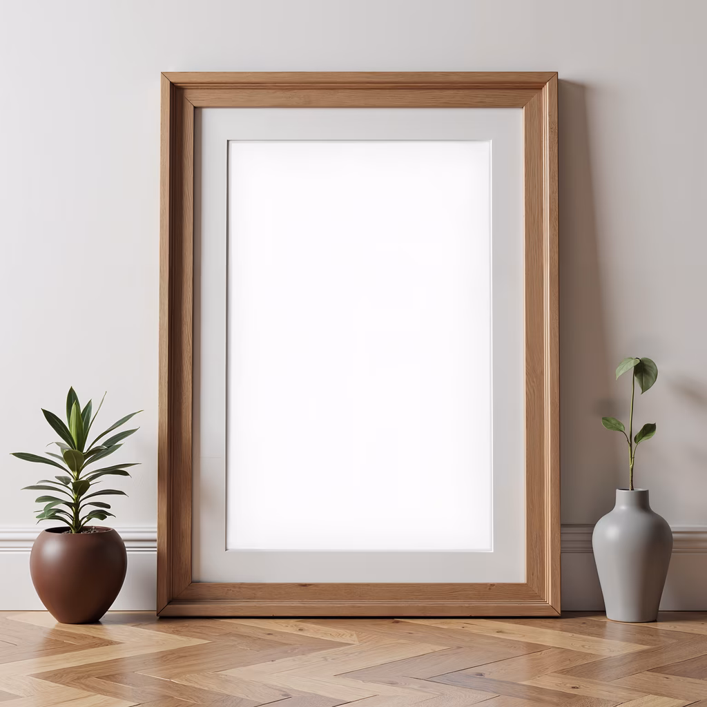 Minimalist interior design with an empty frame and potted plants.