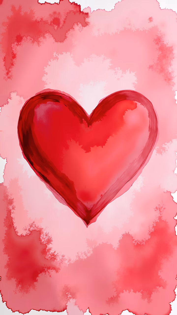 Glossy red heart on soft pink background, evoking love and passion.