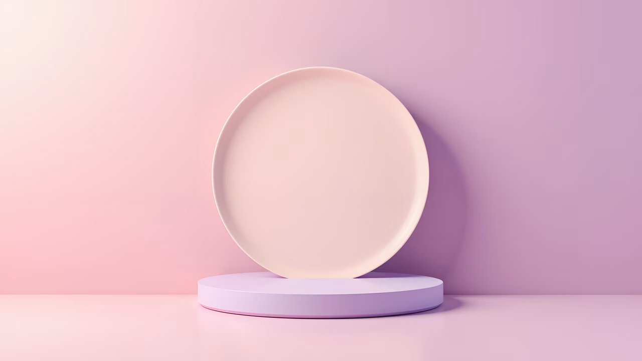 Minimalist round podium with pastel pink tones and soft lighting, creating a serene atmosphere.