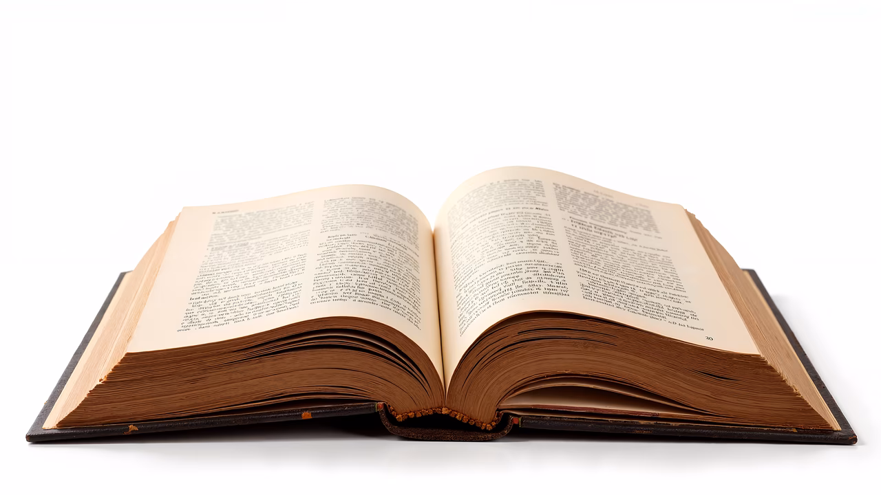 An open book with aged pages and detailed typography, evoking a sense of nostalgia and scholarship.