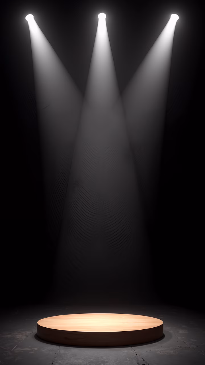 Spotlights converging on a circular stage, creating a dramatic and exciting atmosphere.