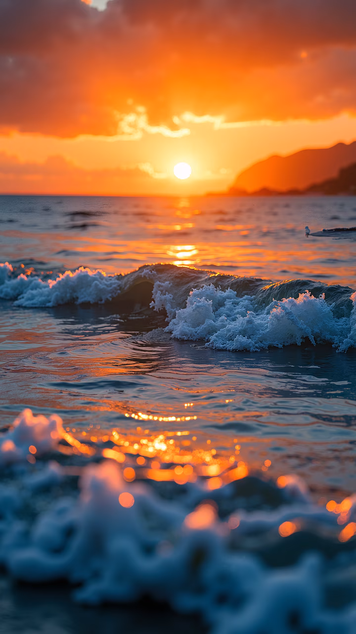 A stunning sunset over the ocean with crashing waves, capturing the serene beauty of nature.