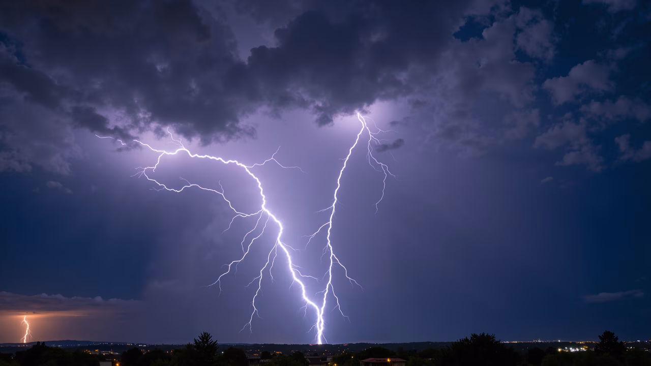 Dramatic lightning strike during a thunderstorm, capturing the intensity and beauty of nature at night.