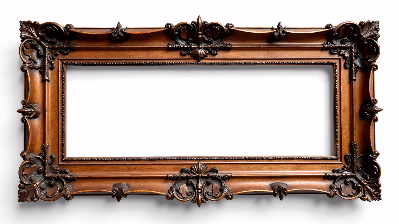 Vintage ornate wooden frame with intricate carvings and warm tones