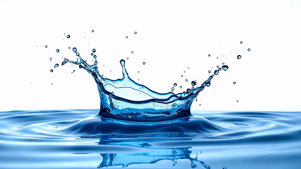 Dynamic water splash captured in a cool blue tone, emphasizing clarity and purity.