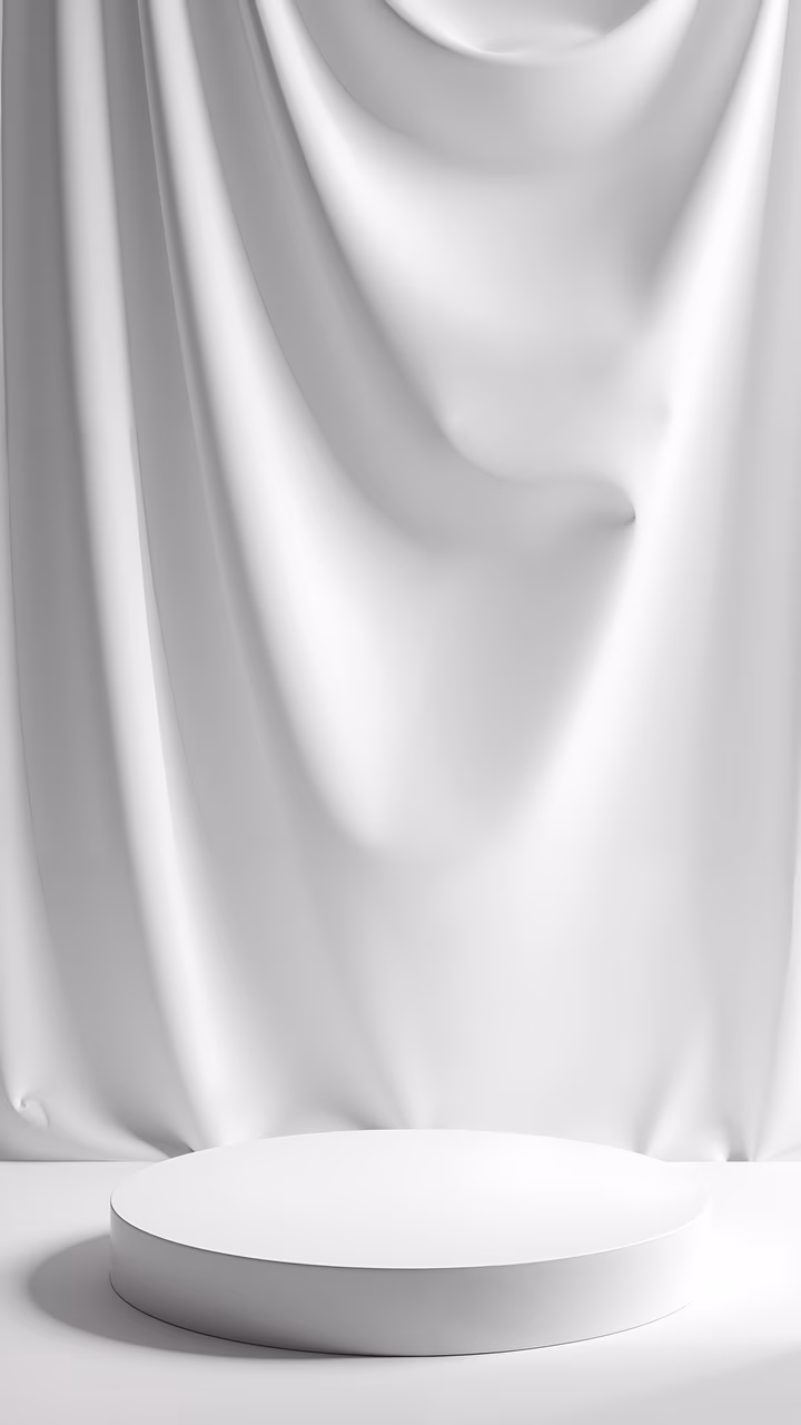 Minimalist white curtain draped over a circular podium, creating a serene and elegant atmosphere.