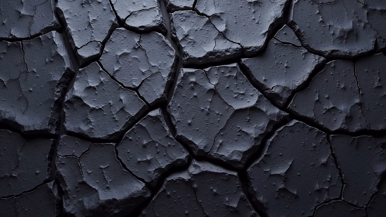 A dramatic depiction of cracked earth in shades of dark gray, highlighting environmental themes.