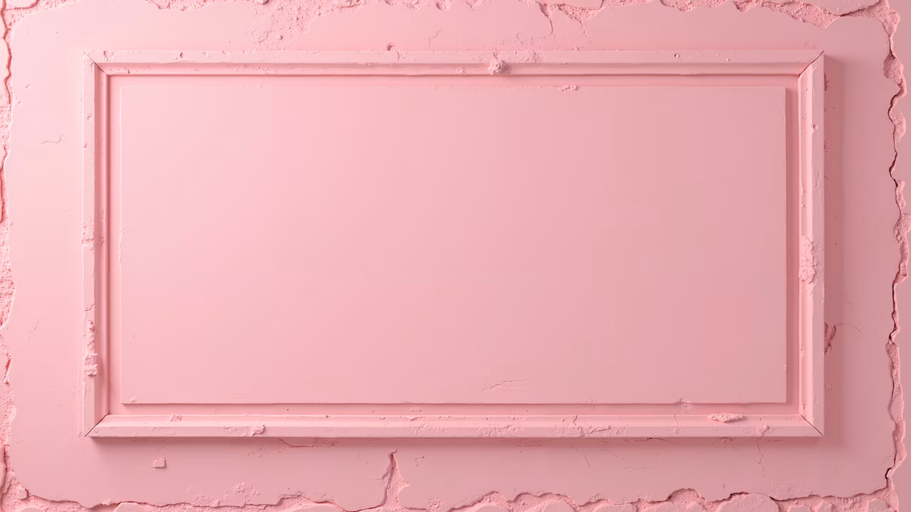 A minimalist pink frame on a textured pink wall, perfect for abstract art or interior design inspiration.