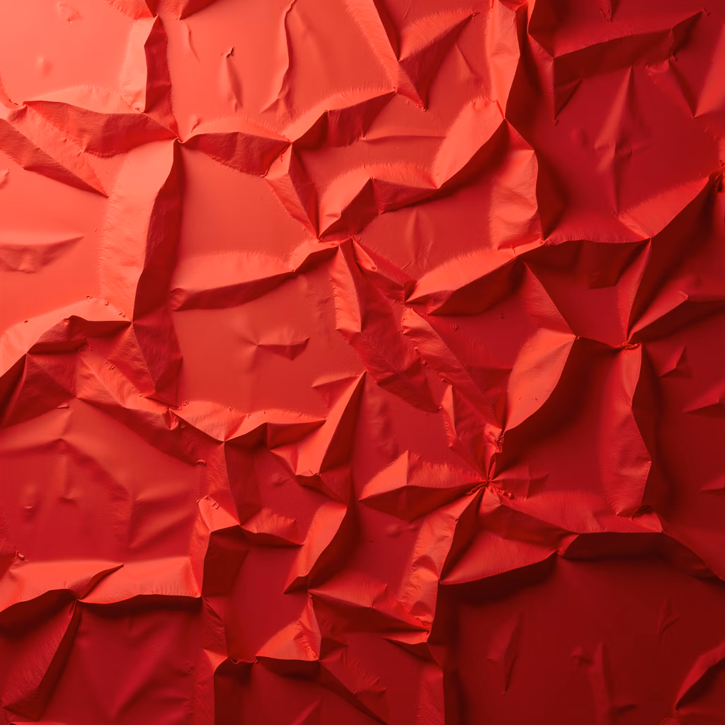 Abstract art featuring crumpled red paper with intricate folds and creases, creating a textured and dynamic surface.