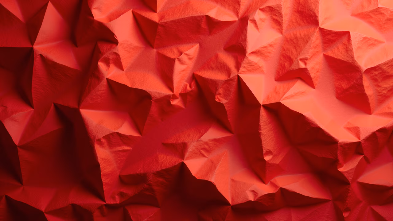 Vibrant red polygonal abstract design with geometric shapes and smooth transitions.