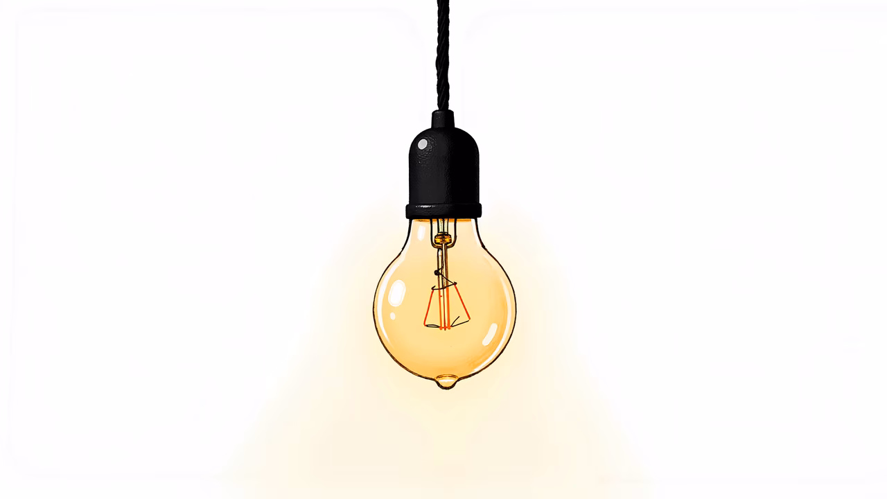 A detailed illustration of a glowing light bulb against a white backdrop, evoking warmth and nostalgia.