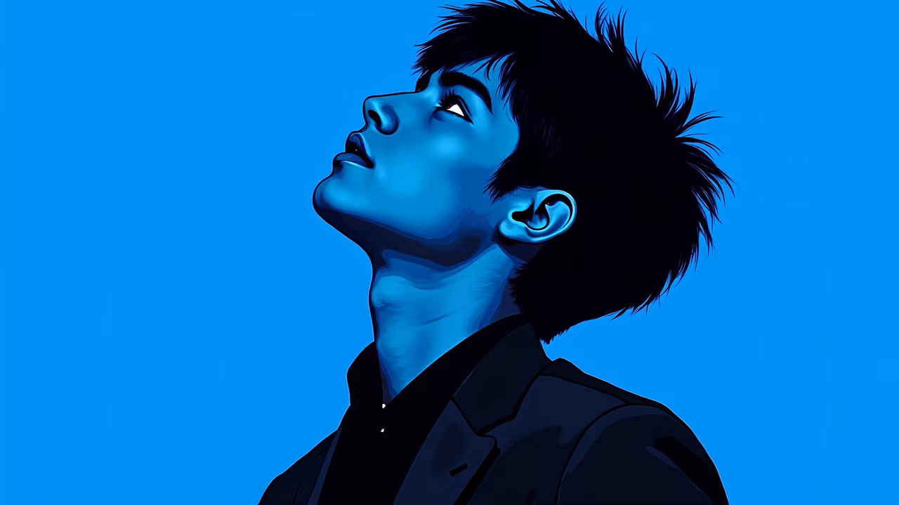 Bold blue portrait of a contemplative individual in a sleek suit.