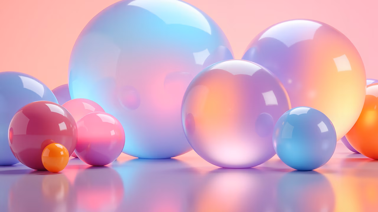 Vibrant, glossy spheres in a playful arrangement on a soft pink background.