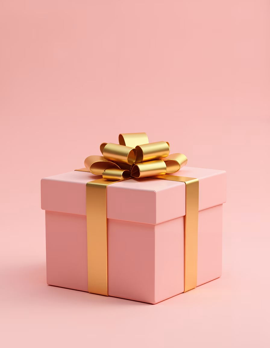 Elegant pink gift box with golden ribbon bow on soft pink background.