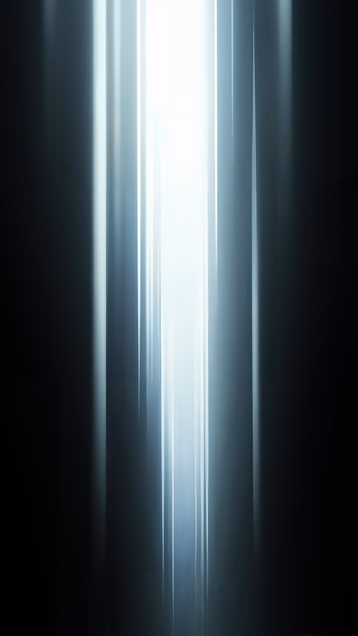 Dramatic light beam against a dark background, creating a sense of mystery and depth.