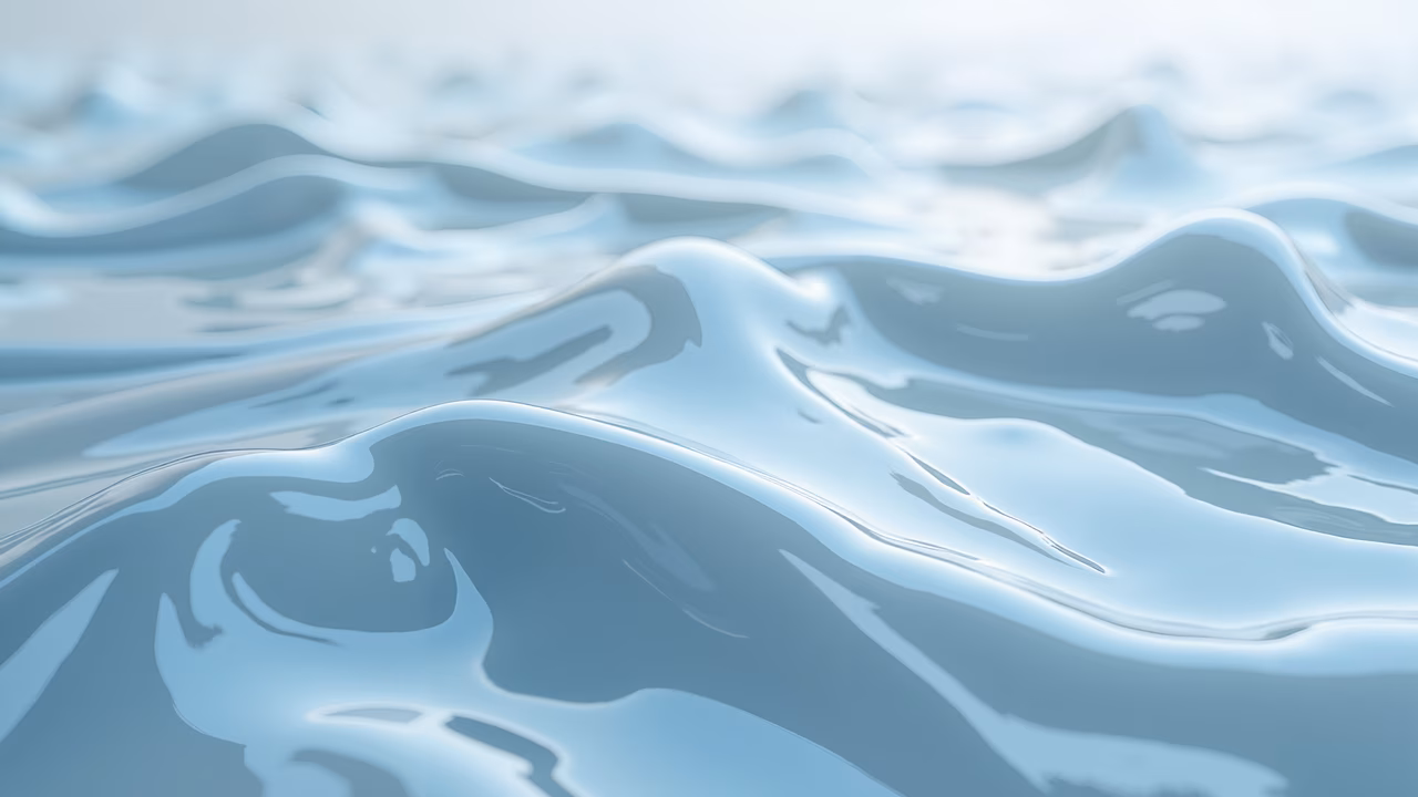 Soft pastel blue liquid waves creating a serene and tranquil atmosphere.