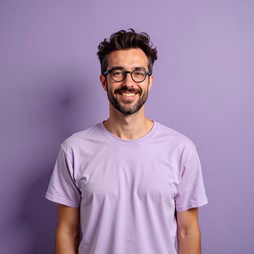Man Smiling in Purple Shirt