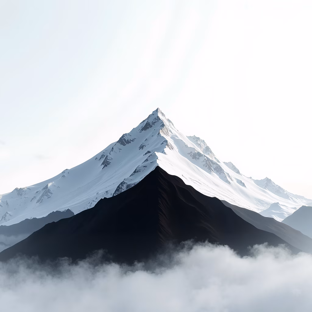Majestic mountain peak in a serene, cold landscape.