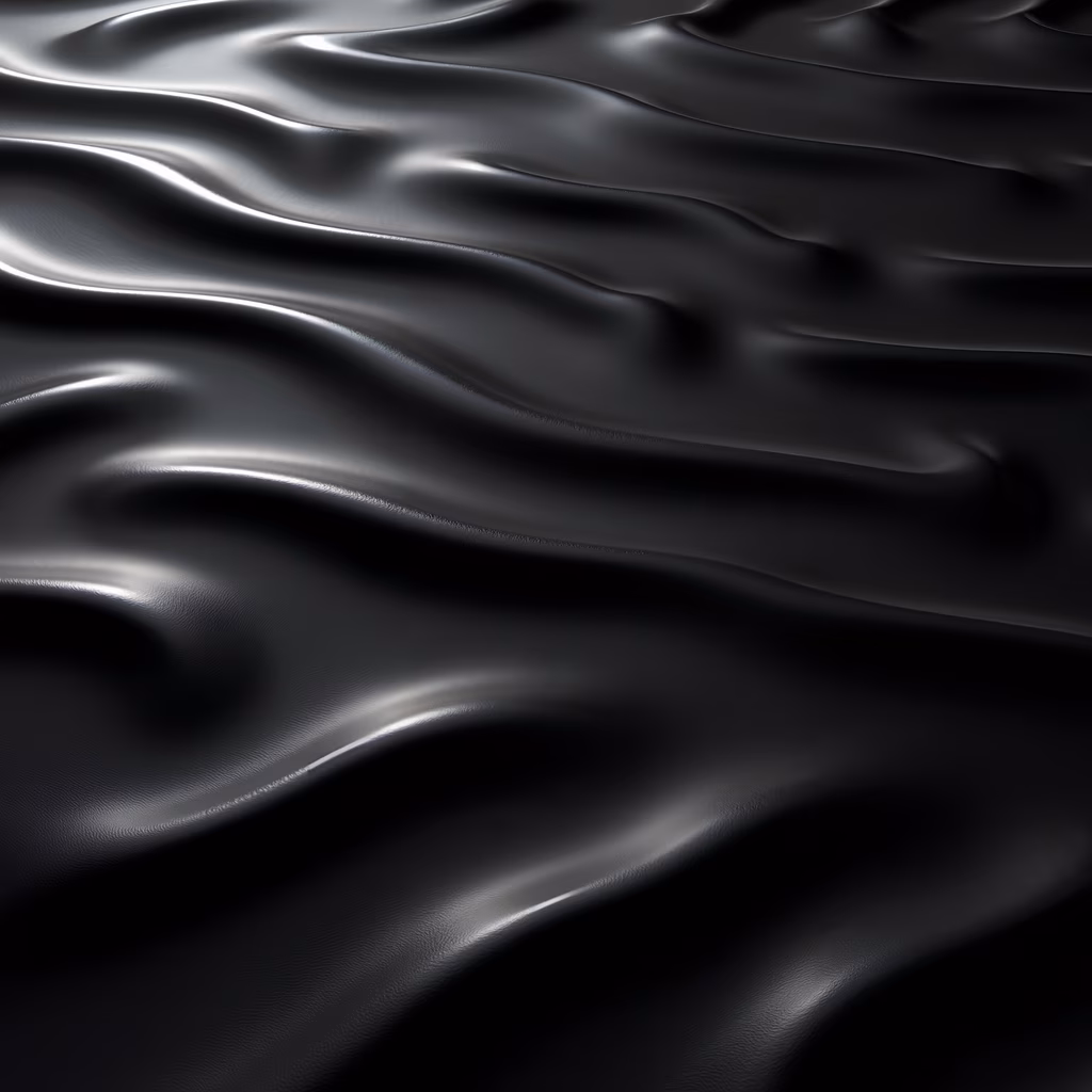 Smooth, glossy black silk fabric with intricate textures and reflections.