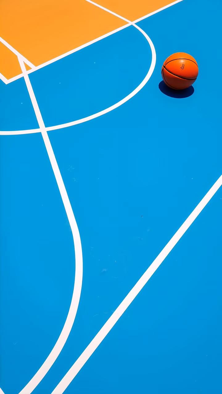 Vibrant basketball court with an orange ball, ready for action.