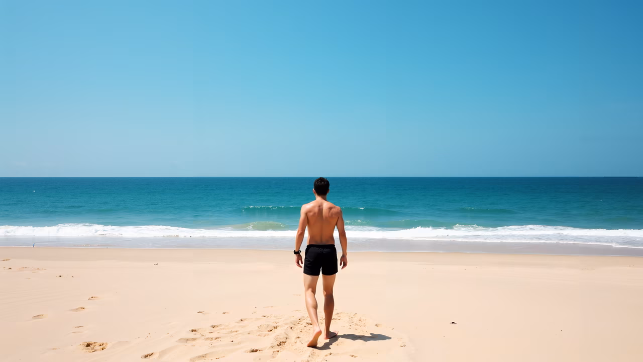Solitude on the beach, serene walk by the sea.