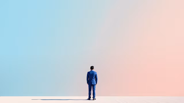 Man in Blue Suit Facing Gradient Sky