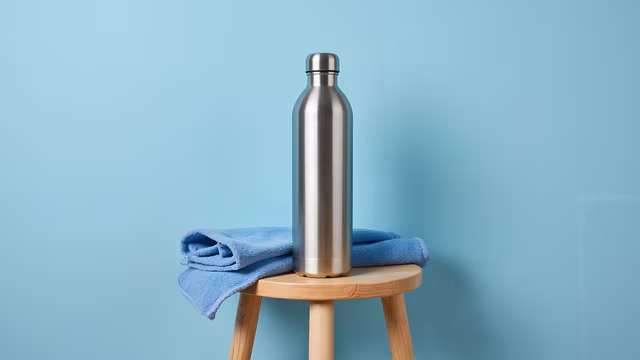 Metal Bottle on Blue Towel