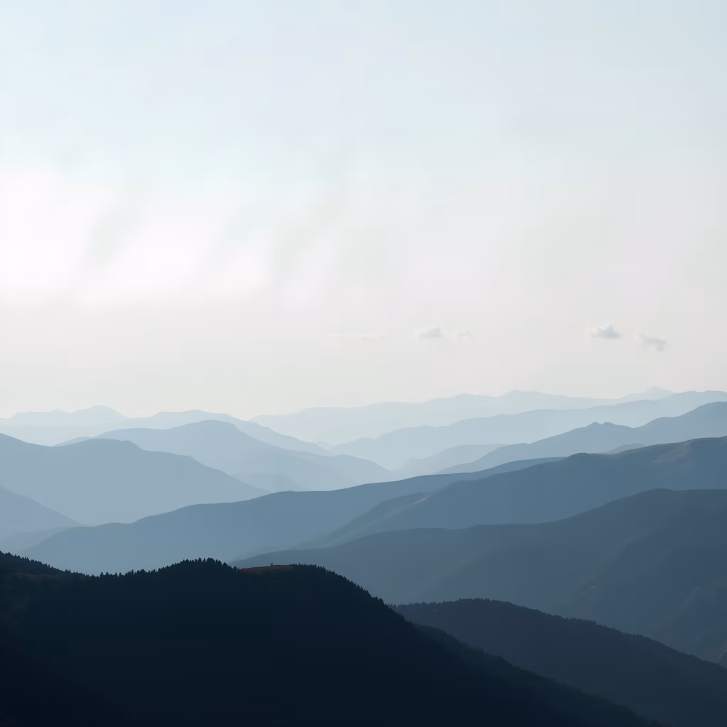 Misty mountains create a serene and contemplative landscape.