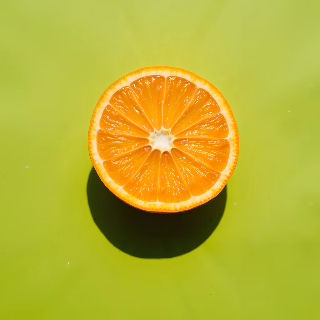 Vibrant orange slice against a lime green backdrop, showcasing freshness and natural beauty.