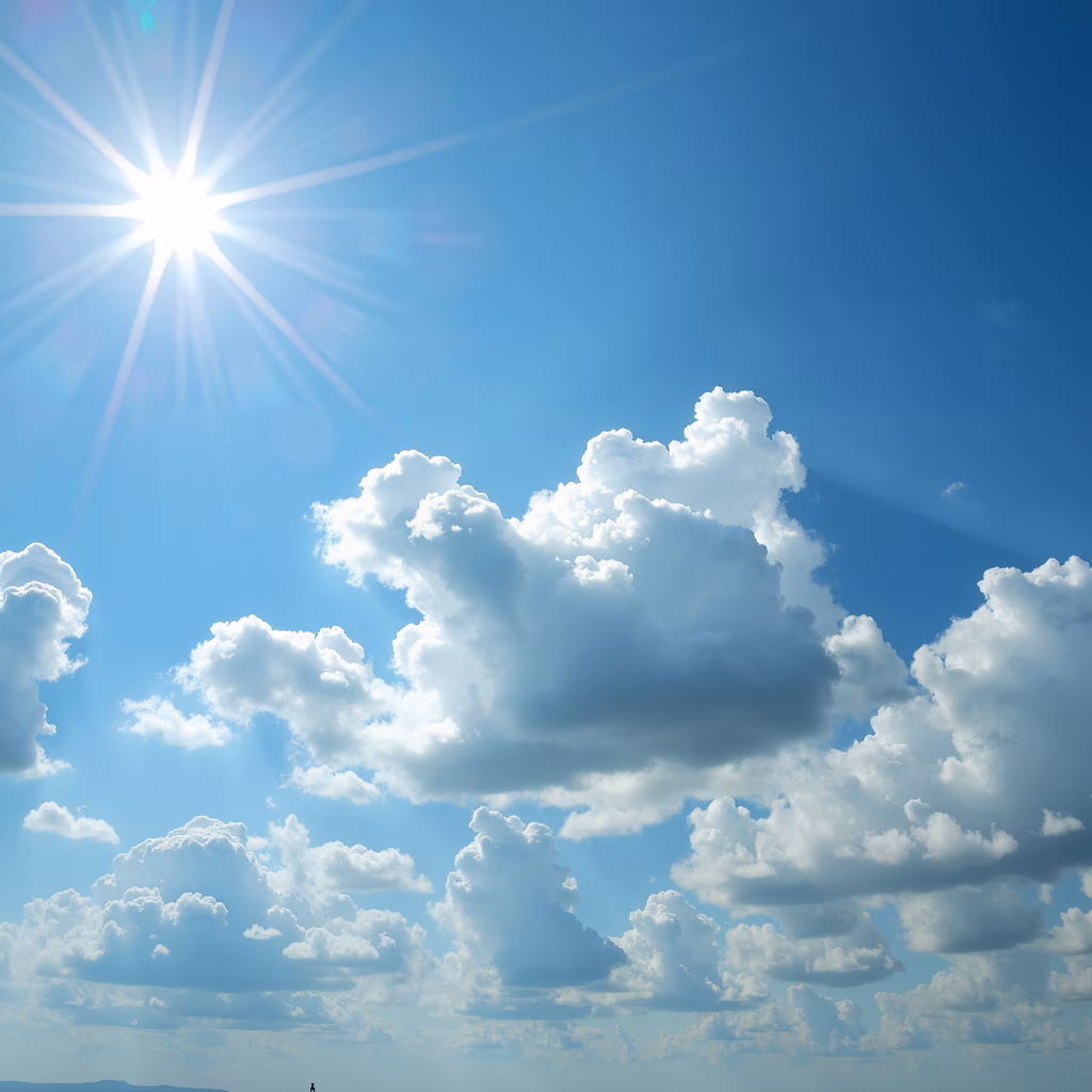 Bright sun and fluffy clouds in a serene sky scene.