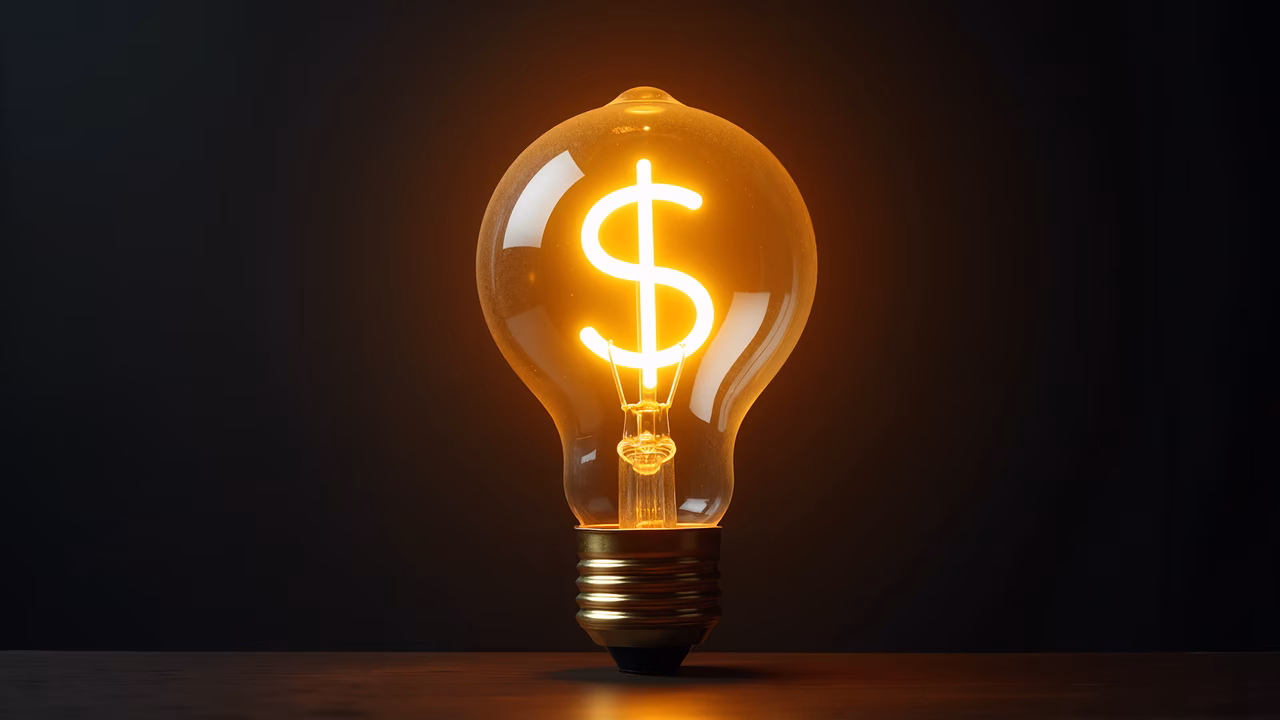 Glowing light bulb with dollar sign symbolizing financial innovation.