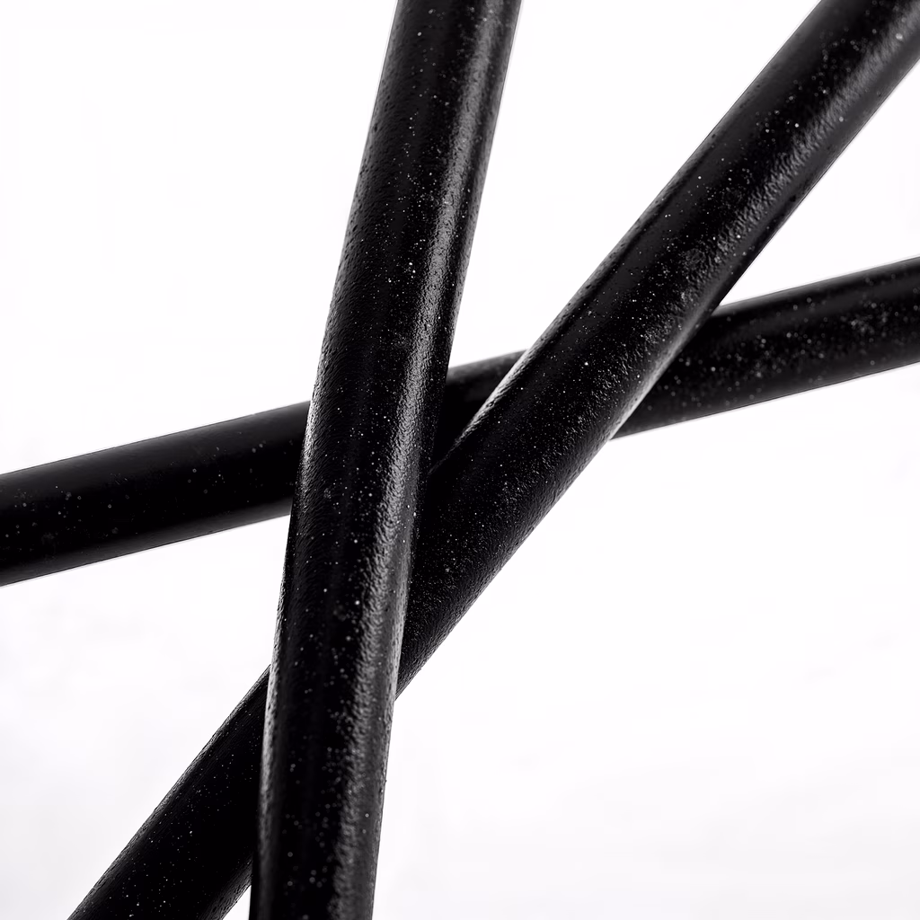 Close-up of glossy black lines against a white backdrop, emphasizing texture and contrast.