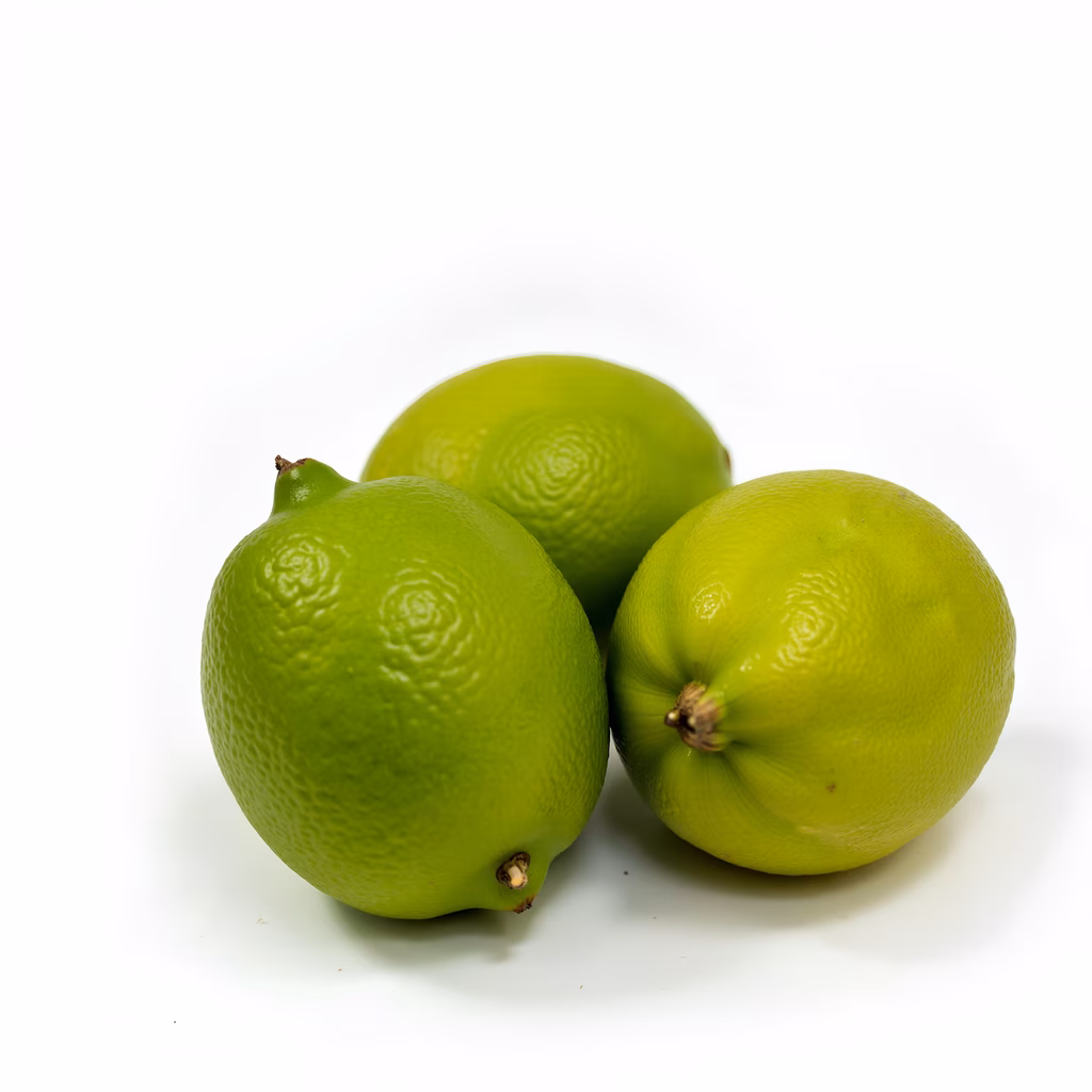 Bright green limes on a white background