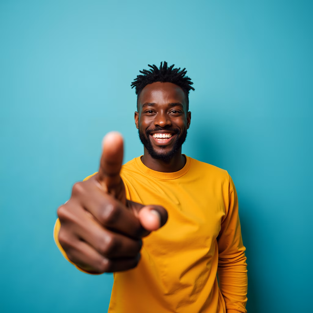 Bright yellow sweater, teal background, positive gesture, cheerful individual