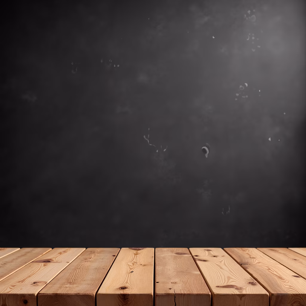 Close-up of wooden floor against dark textured wall, showcasing rustic charm and simplicity.