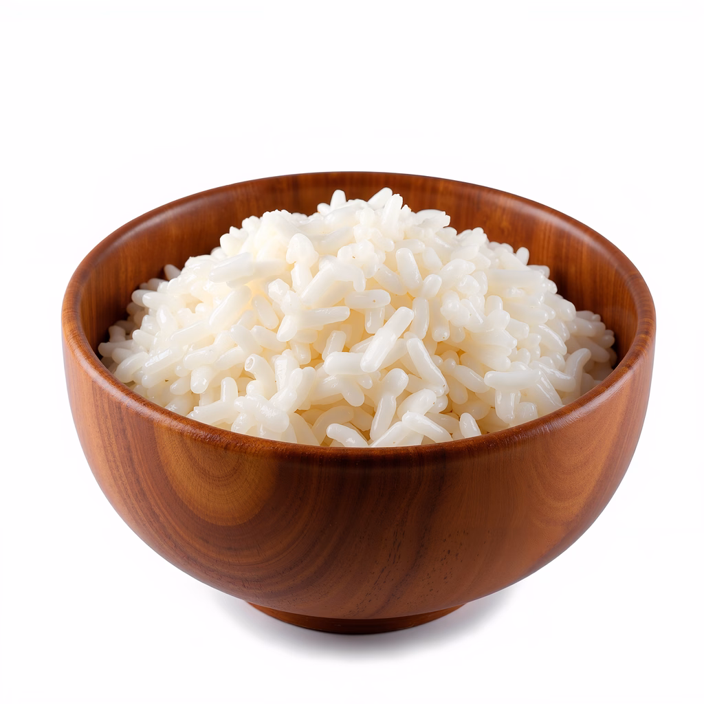 Close-up photo of white rice in a wooden bowl, emphasizing texture and simplicity.