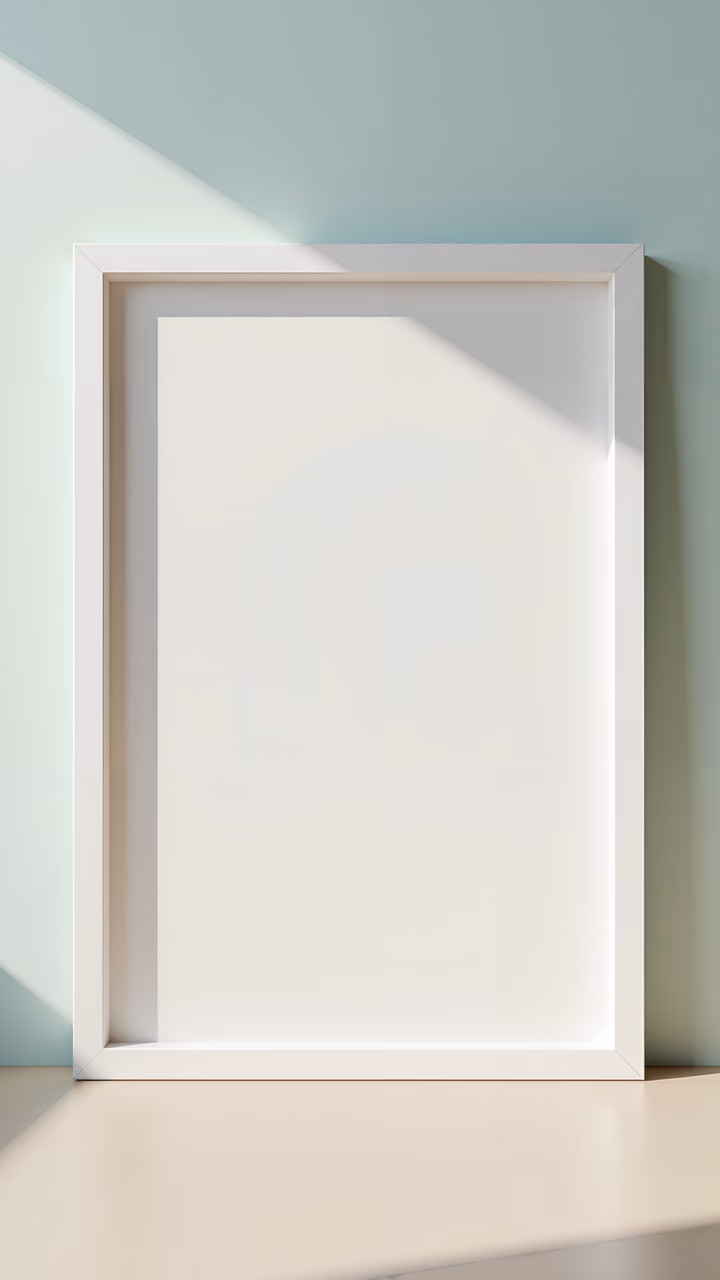 Empty minimalist frame against a pastel green wall, evoking simplicity and calmness.