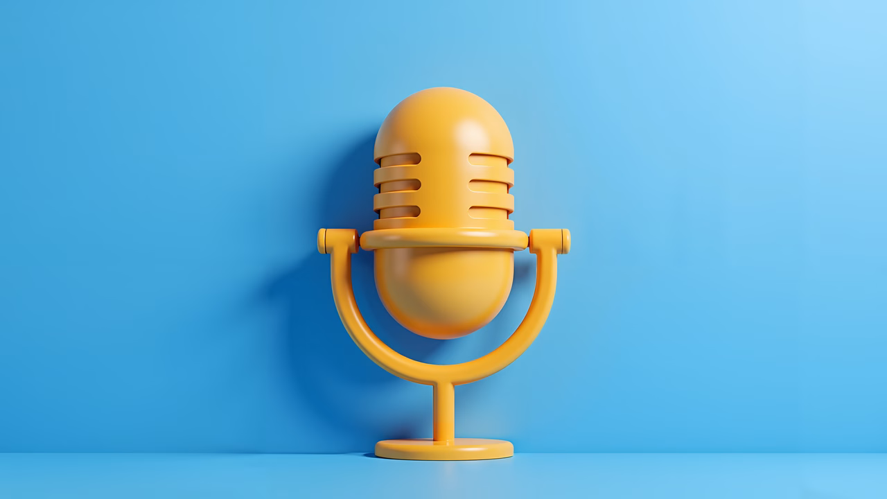 Classic vintage microphone on a bright blue background.