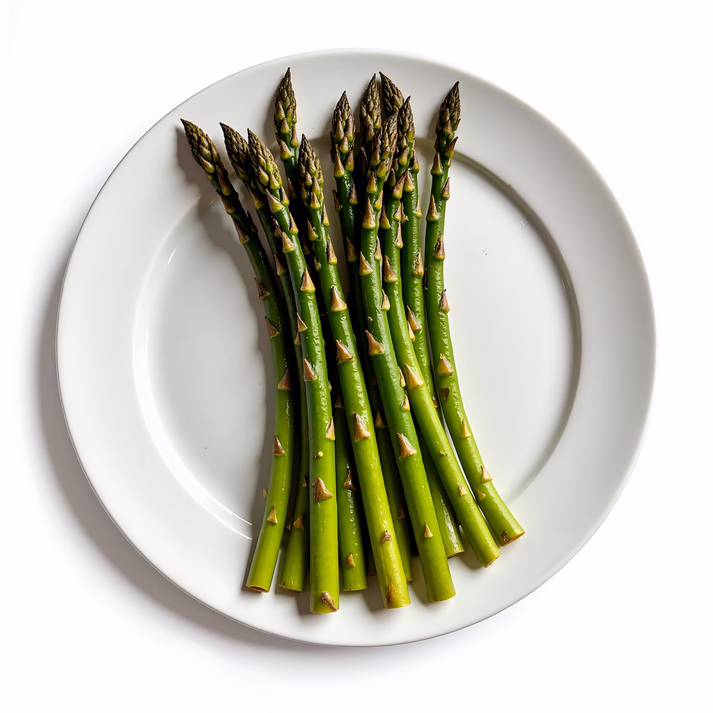 Fresh asparagus on a white plate, minimalist food photography.