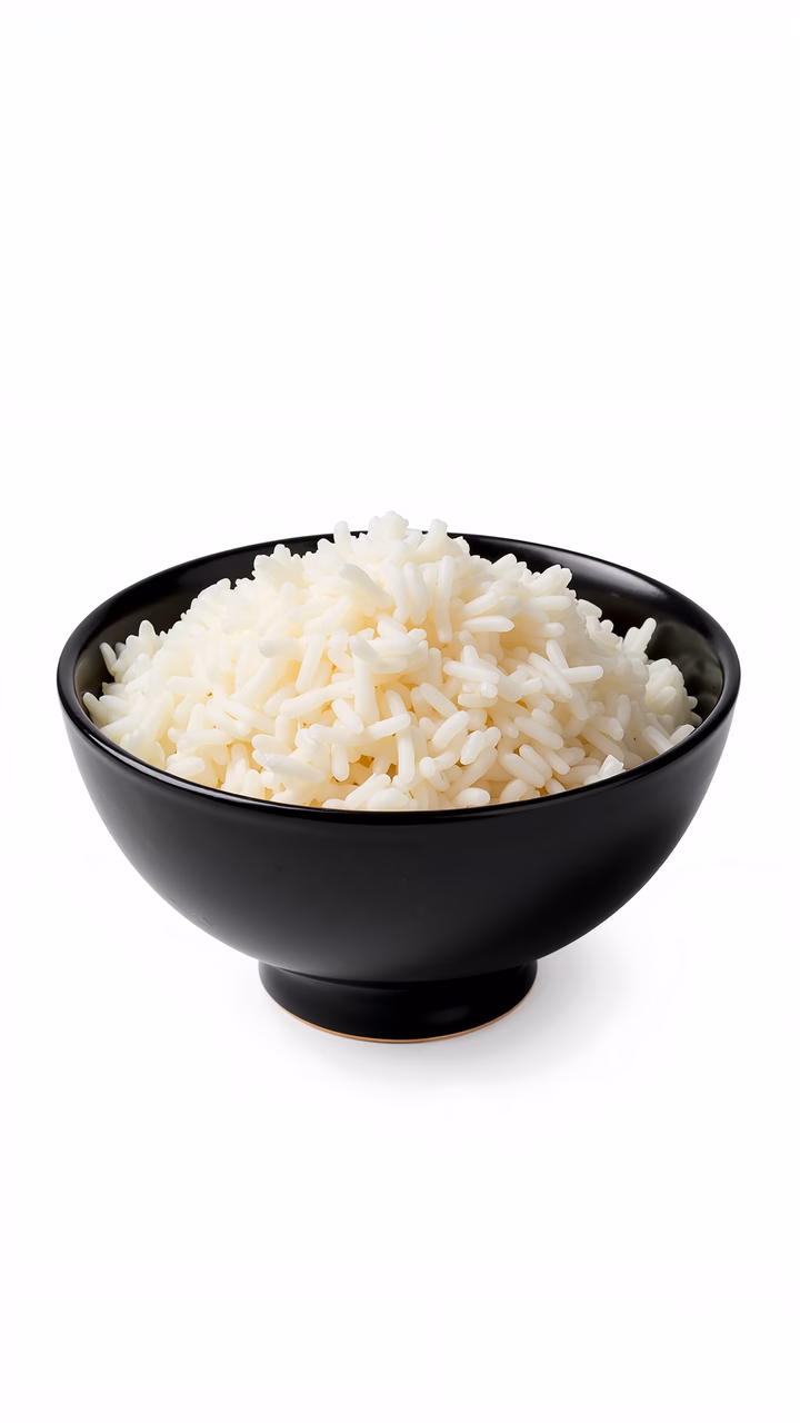 Close-up of fluffy white rice in a glossy black bowl on a white background.