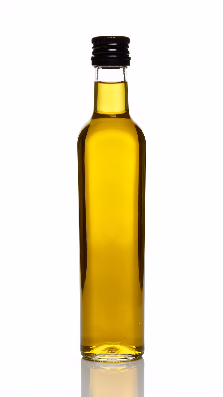 Transparent olive oil bottle on a white background.