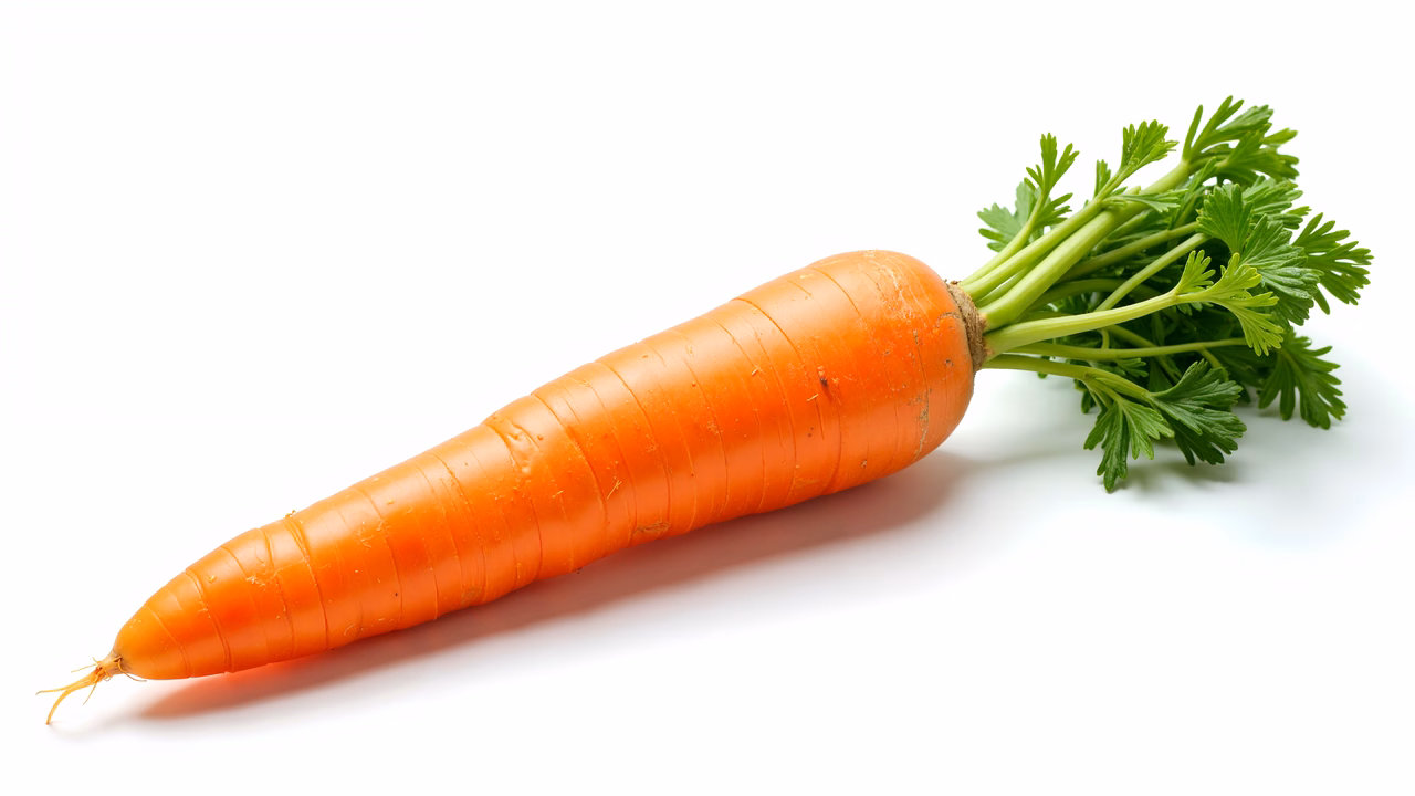 Vibrant orange carrot on a white background, emphasizing freshness and health.