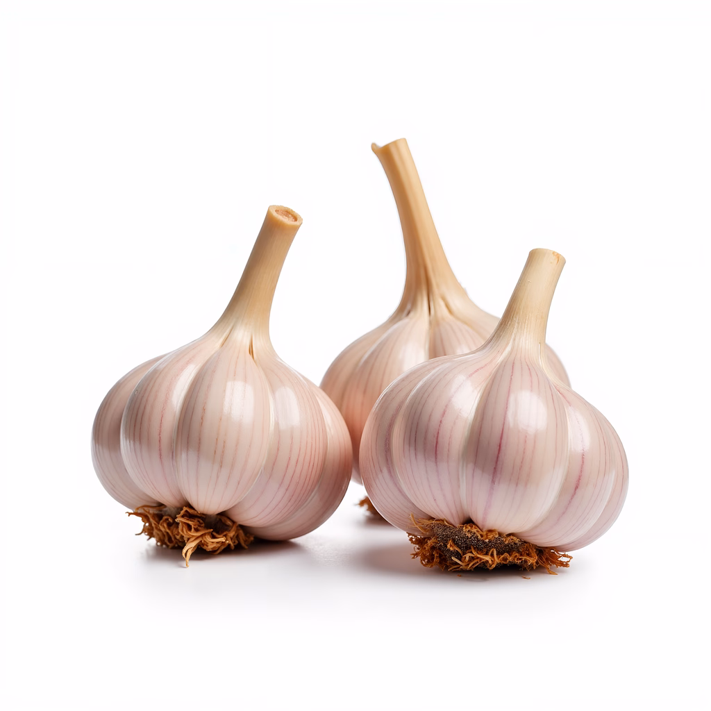 Close-up of garlic cloves on a white background, showcasing their natural texture and form.