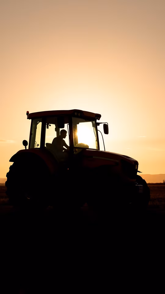 Tractor Silhouette at Sunset