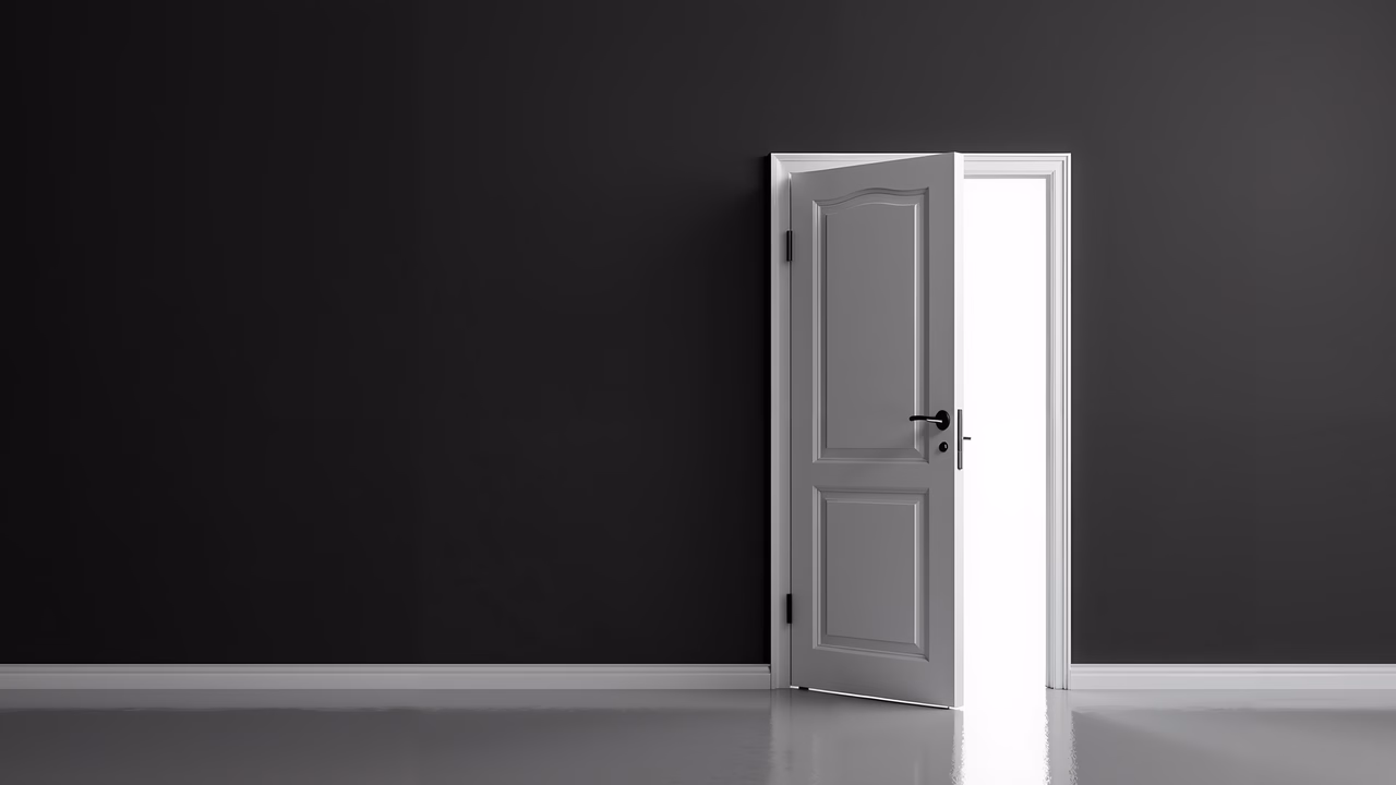Minimalist door opening to bright light, symbolizing hope and new beginnings.