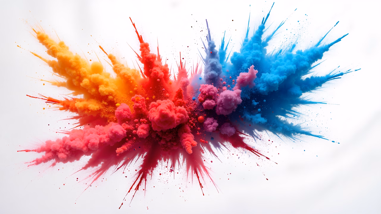 Vibrant explosion of colorful powder against a white background.