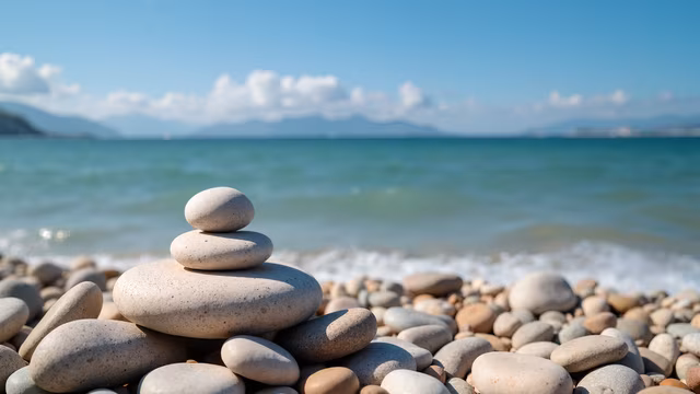 Stacked Pebbles by the Sea
