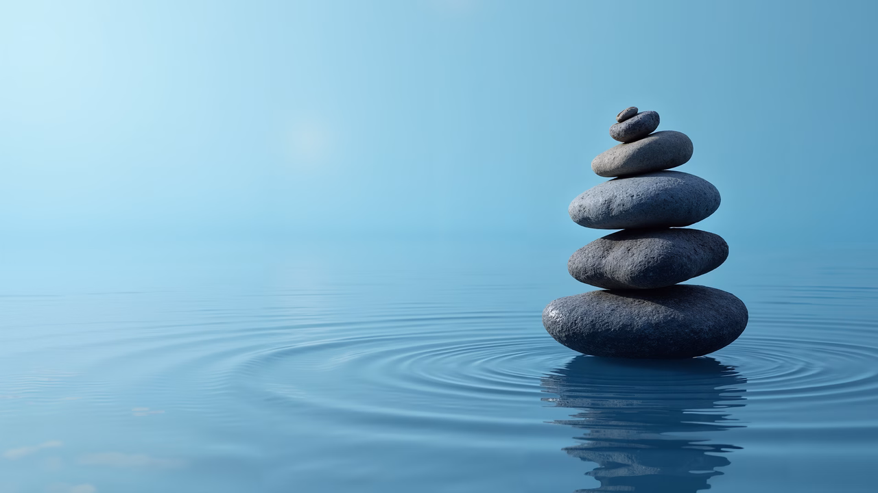 Minimalist illustration of stacked stones in serene blue tones, evoking peace and balance.